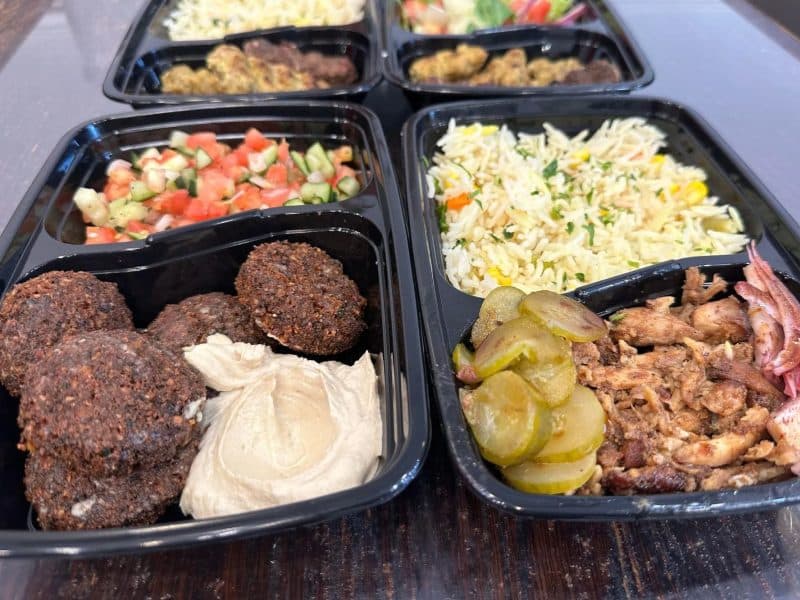 Prepared Middle Eastern-style meal in a delivery tray